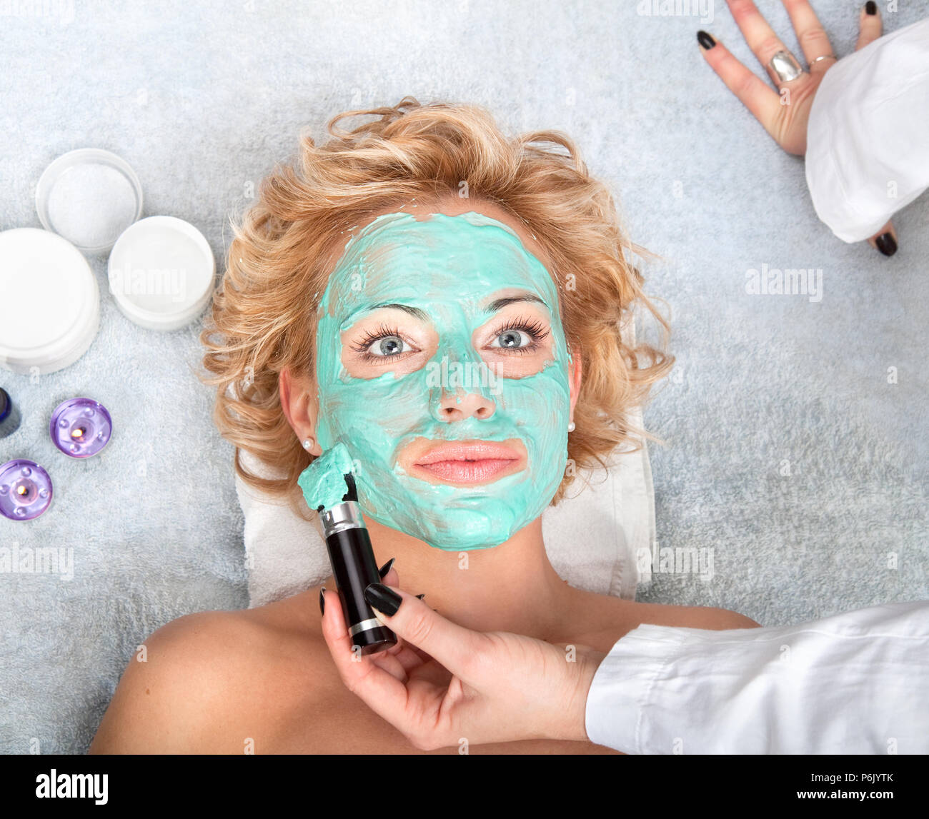 Spa thermal mud face pack on woman face Stock Photo