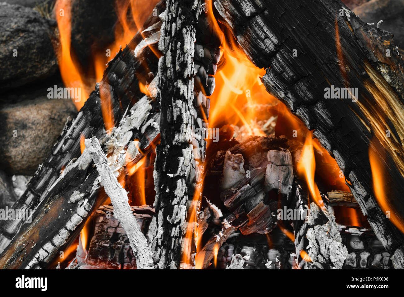 Burning bonfire with visible hot charcoal and ashes Stock Photo