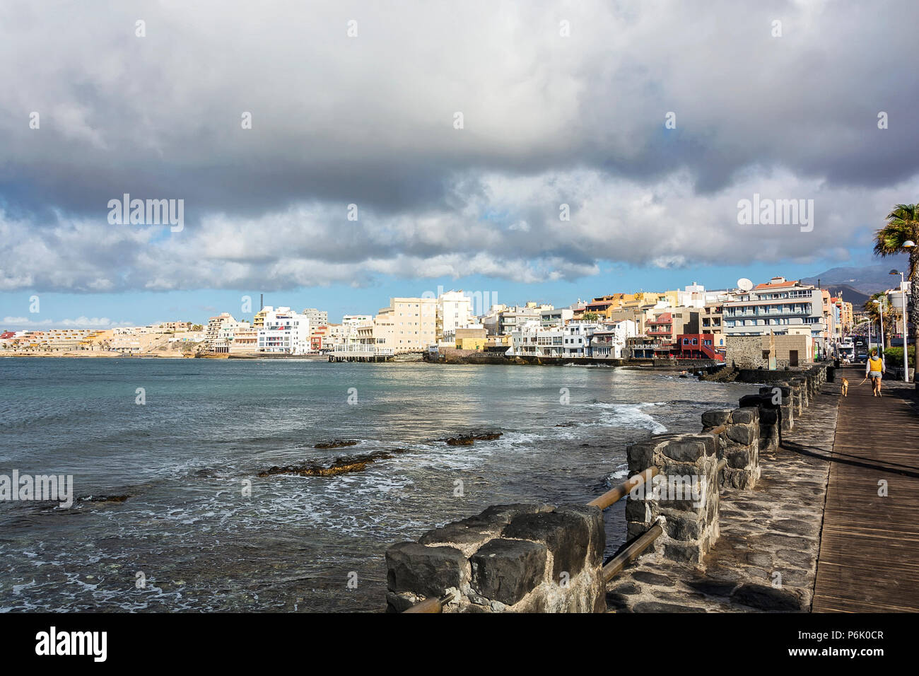 Low Cumulus clouds, low tide and calm ocean near the resort town of El  Medano, Tenerife, Canary Islands, Spain Stock Photo - Alamy