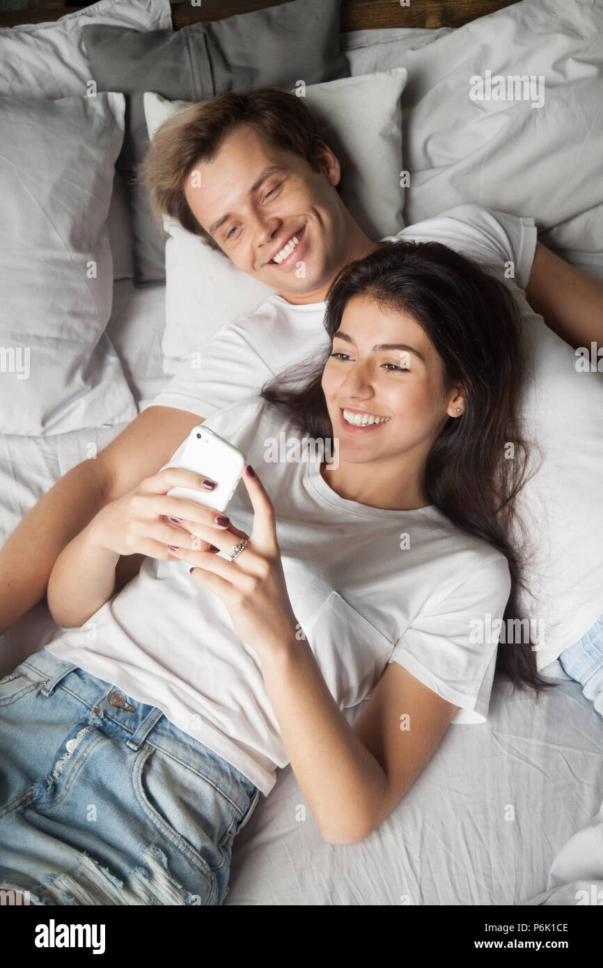 Couple reading on bed hi-res stock photography and images - Alamy