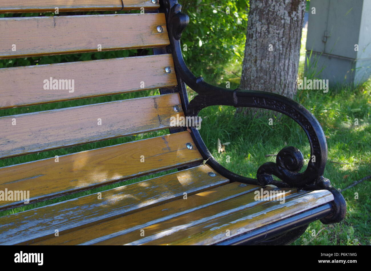 A park bench made from wood is inviting to relax Stock Photo Alamy