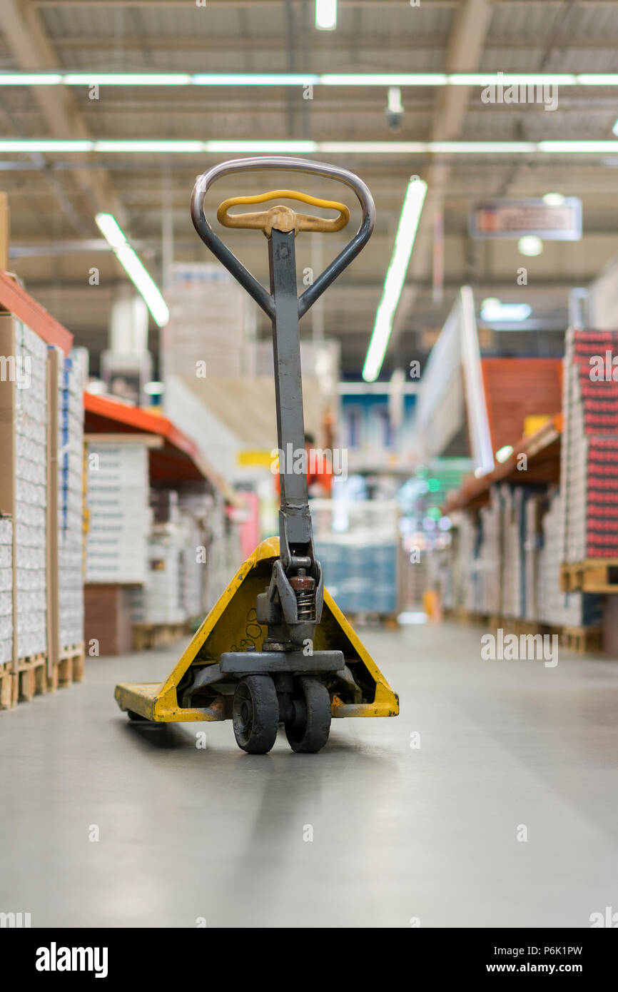 pallet jack in a building store. Manual pallet jack in supermarket. Stock Photo