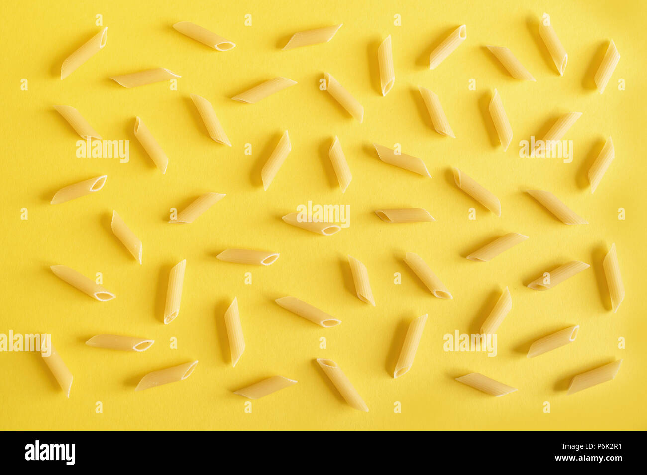 Download Penne Pasta On Yellow Background Top View Flat Lay Stock Photo 210631653 Alamy Yellowimages Mockups