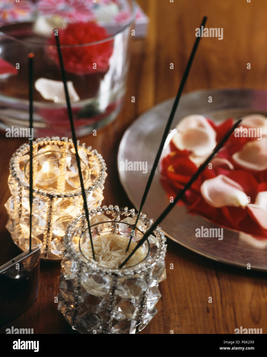 Still Lifde Of Candles And Cream Roses In Small Pressed Glass