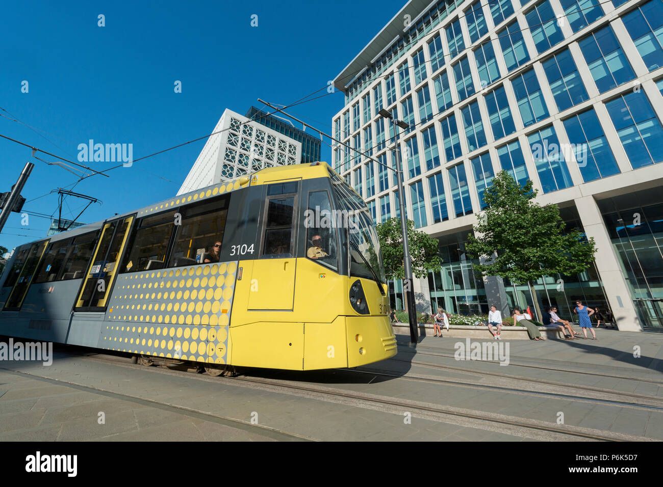 A Metrolink tram passes infront of the KPMG Buidling in St Peter's Sqaure in Manchester. Stock Photo