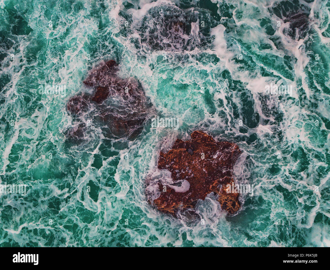 Aerial view of rocky coastline with crashing waves Stock Photo - Alamy