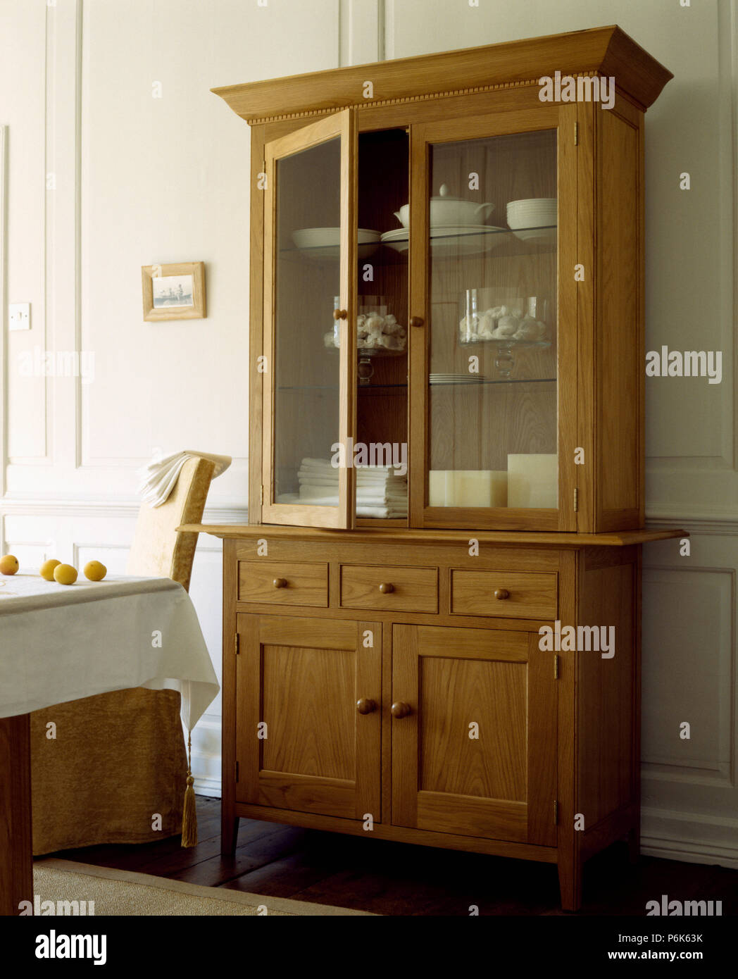 Glass Fronted Dresser In Traditional Dining Room Stock Photo
