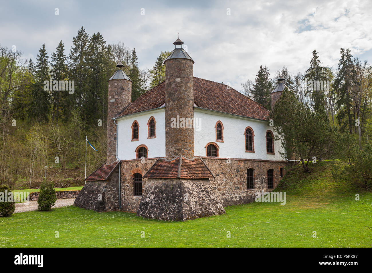 Wine distillery, interesting stone building with big chimneys. Heimtali, Estonia. Stock Photo