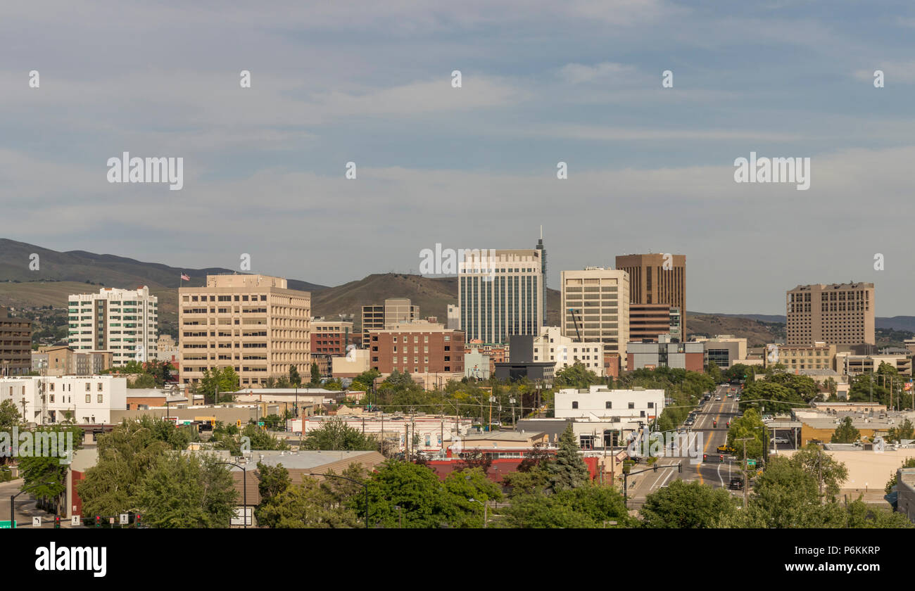 Boise, Idaho. Cityscape with a view from the west. Downtown streets and skyscrapers and the Boise Foothills on a summer evening. Stock Photo