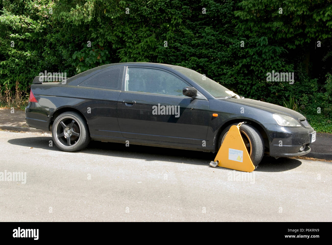 Car with Wheel Clamp Stock Photo