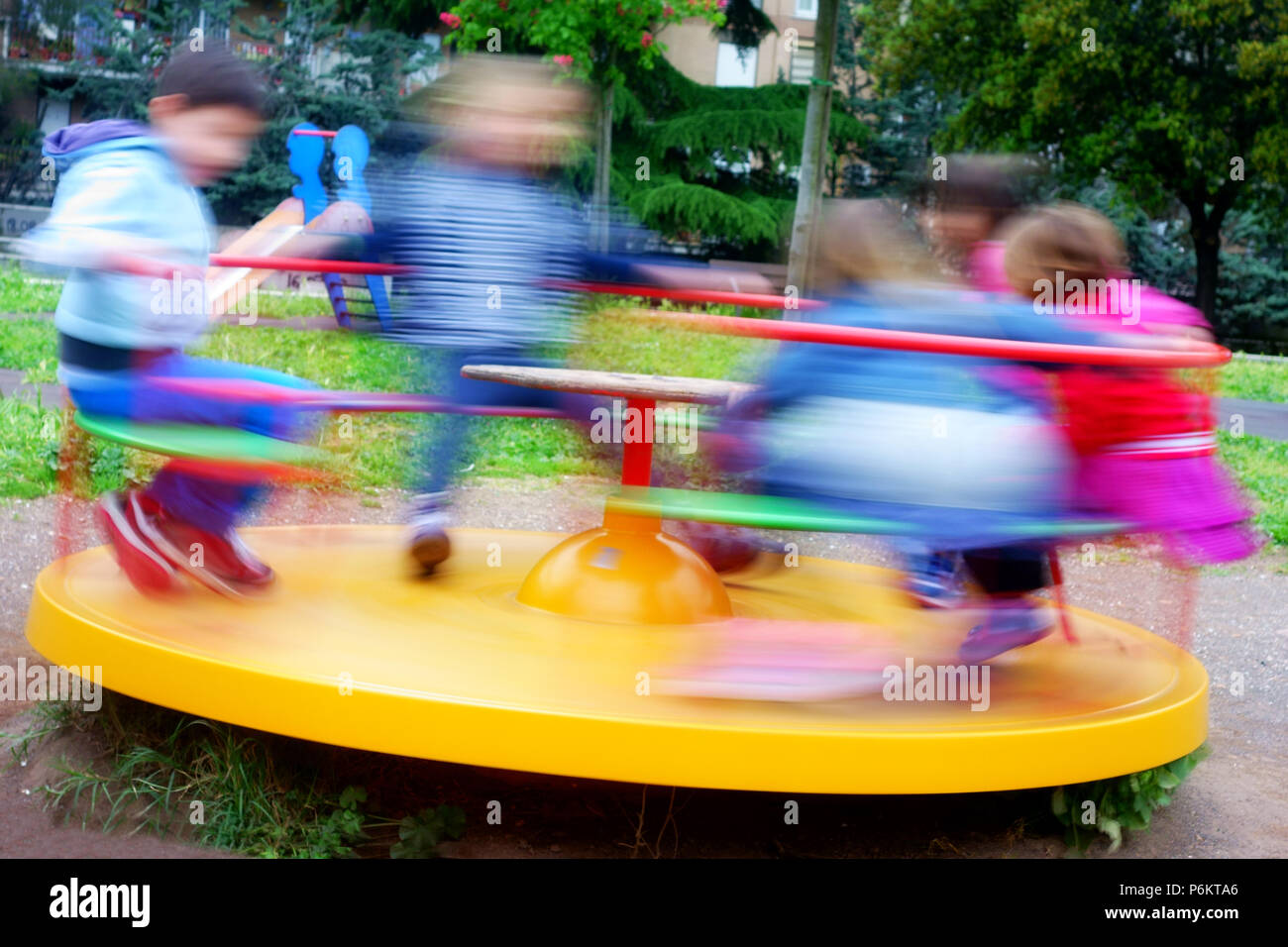 children having fun at colorful carousel spinning round fast Stock ...