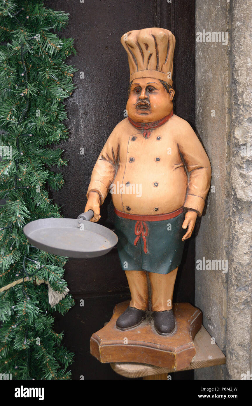 A mannequin in a restaurant doorway in Spoleto Italy Stock Photo