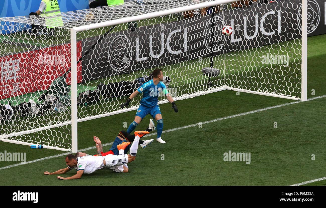 Russia's Sergei Ignashevich (left) scores an own goal during the FIFA World Cup 2018, round of sixteen match at The Luzhniki Stadium, Moscow. Stock Photo