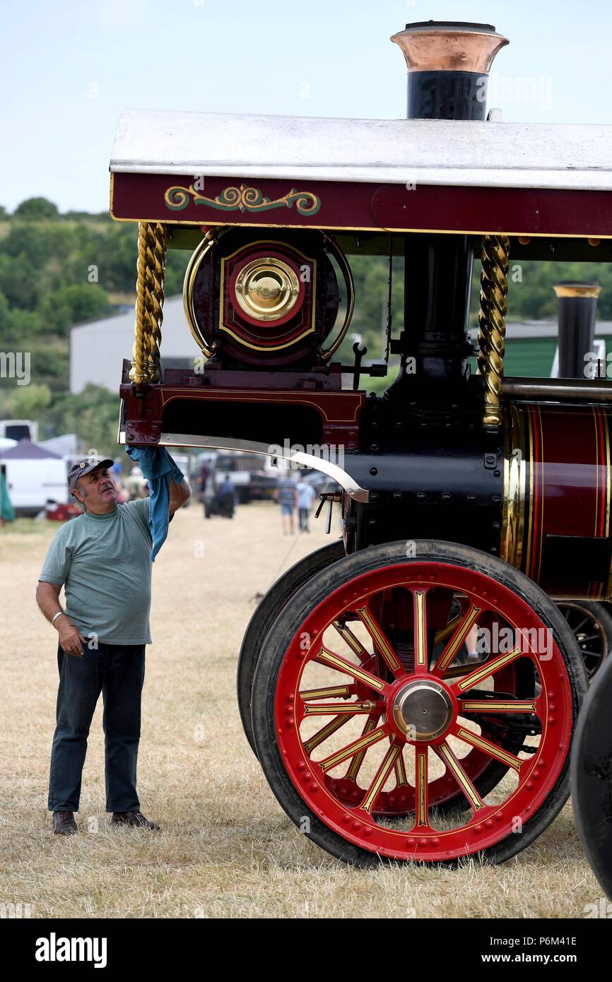 Dorset, UK. 1st Jul, 2018. Chickerell Steam and Vintage Show, Dorset, Brian Burden polishes his Burrell Showmans Road Locomotive 3949, 'Princess Mary' steam engine, at the annual two-day event, Credit: Finnbarr Webster/Alamy Live News Stock Photo