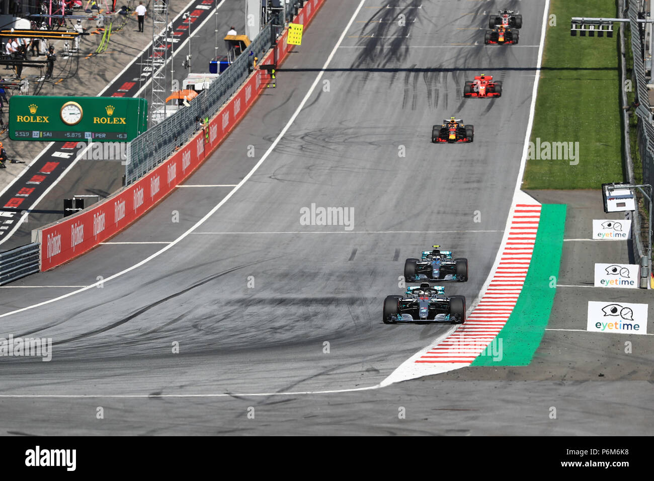 Red Bull Ring, Spielberg, Austria. 1st July, 2018. Austrian Formula One  Grand Prix, Sunday race day; Mercedes AMG Petronas Motorsport, Lewis  Hamilton leads on lap 2 ahead of Bottas who took back