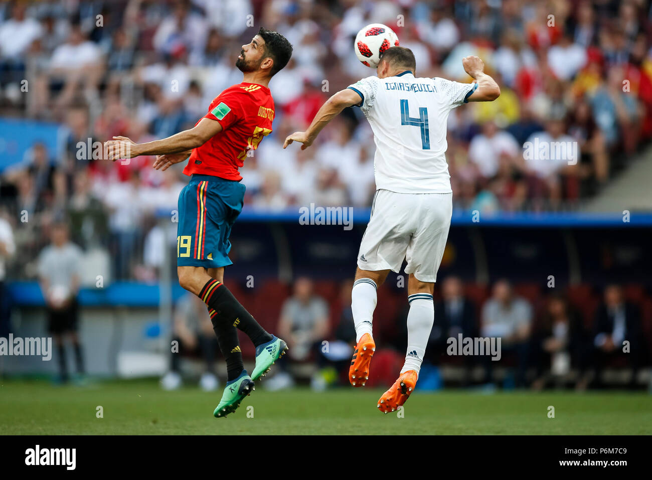 Moscow, Russia. 1st July, 2018. Moscow, Russia. 1st Jul, 2018. Diego Costa of Spain and Sergey Ignashevich of Russia during the 2018 FIFA World Cup Round of 16 match between Spain and Russia at Luzhniki Stadium on July 1st 2018 in Moscow, Russia.  Credit: PHC Images/Alamy Live News Credit: PHC Images/Alamy Live News Stock Photo