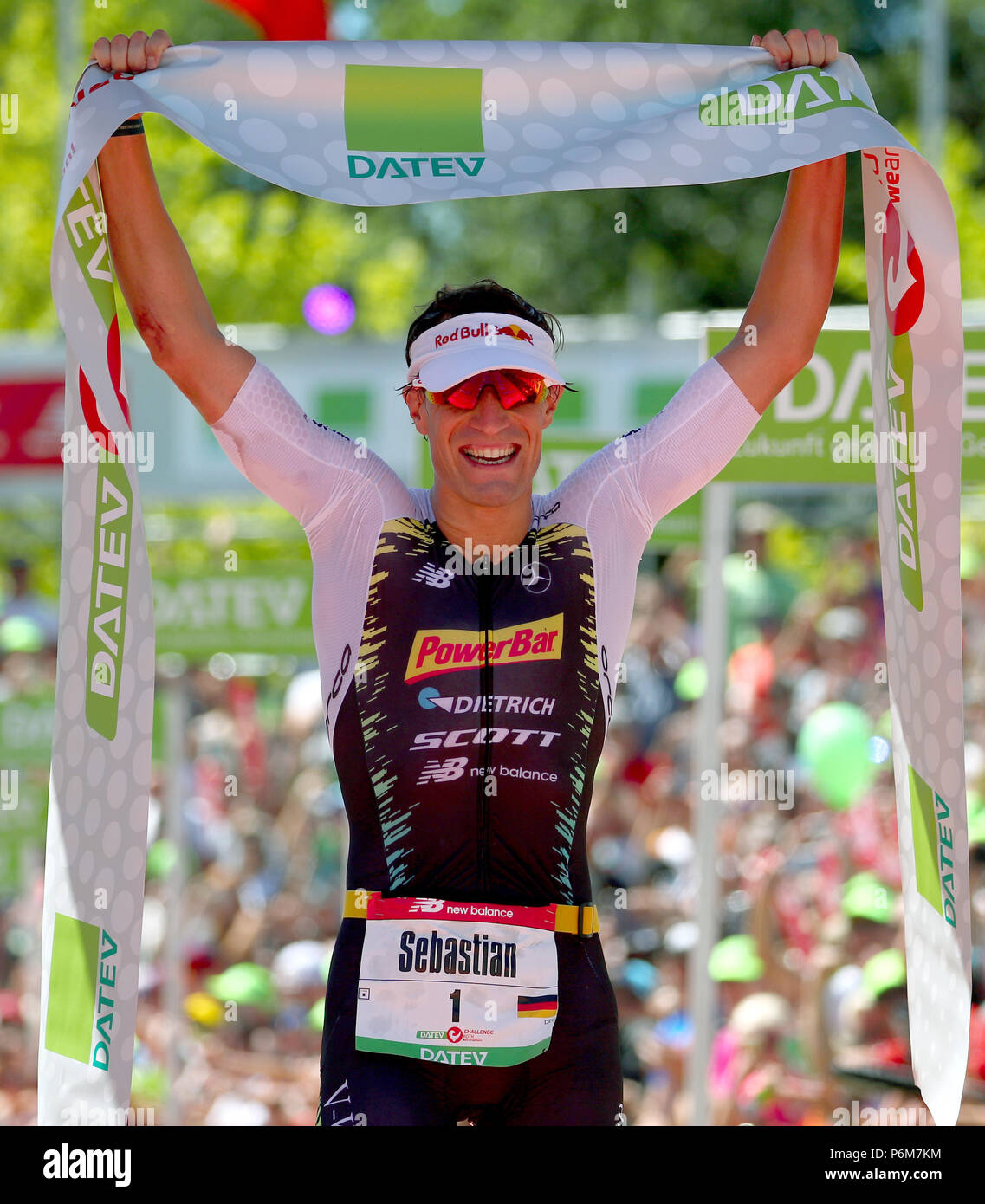 Roth, Germany. 01st July, 2018. German triathlete Sebastian Kienle is the  first to cross the finish line at the Triathlon DATEV Challenge Roth 2018.  At the 17th occasion of the event, participants
