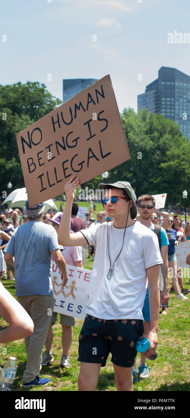 Boston, Massachusetts, USA. 30th June, 2018.  U.S. Demonstrator holding a sign as thousands gathered in the Boston Common in Boston, MA during the Rally against Family Separation by the current United States administration. Rallies against U.S. President Donald Trump’s policy of the detention of immigrants and immigrant families separated by U.S. customs and border agents (I.C.E.) took place in more than 750 US cities on June 30th. Stock Photo