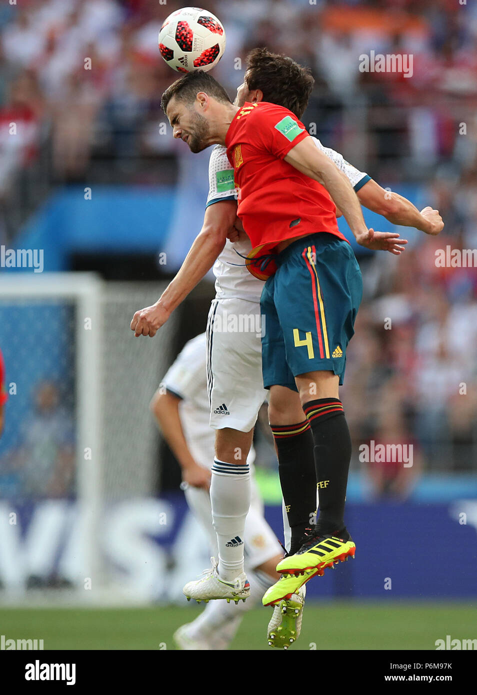Moscow, Russia. 1st July, 2018. Nacho (front) of Spain vies with Yury Zhirkov of Russia during the 2018 FIFA World Cup round of 16 match between Spain and Russia in Moscow, Russia, July 1, 2018. Credit: Wu Zhuang/Xinhua/Alamy Live News Stock Photo