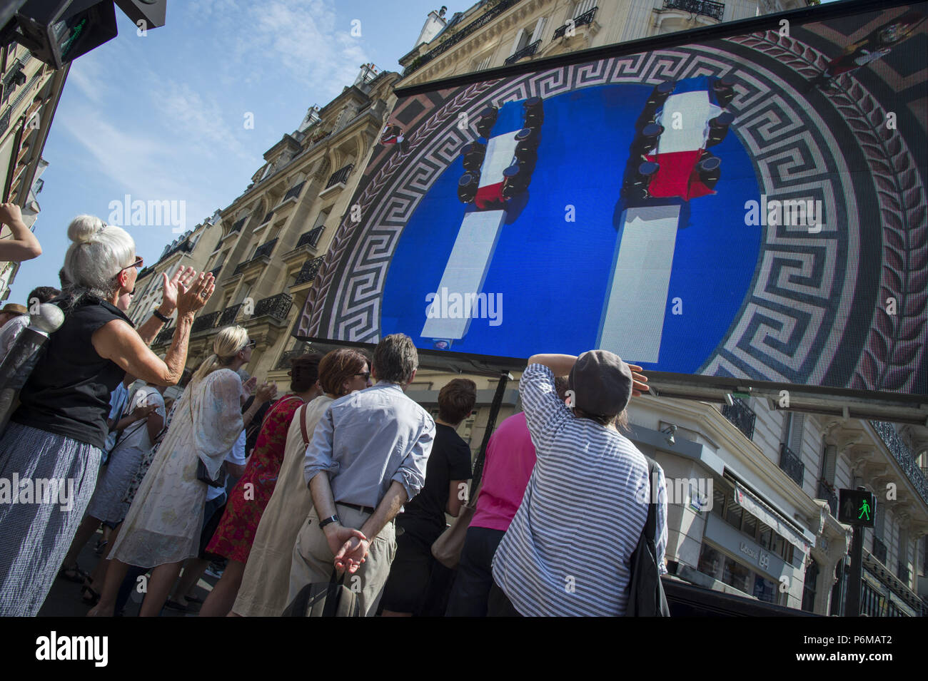 Paris, Ile de France, France. 1st July, 2018. People are seen watching the burial ceremony on a huge screen.Burial ceremony at the Pantheon of former French politician and Holocaust survivor Simone Veil and her husband Antoine Veil in Paris. Former Health Minister, Simone Veil, who passed away on June 30, 2017 became president of the European Parliament and one of France's most revered politicians by advocating the 1975 law legalizing abortion in France. Credit: Thierry Le Fouille/SOPA Images/ZUMA Wire/Alamy Live News Stock Photo