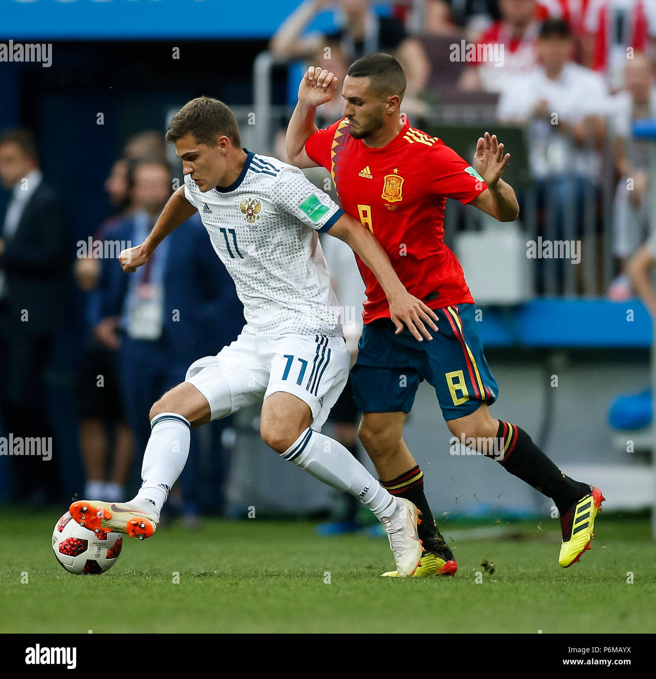Moscow, Russia. 1st July, 2018. Roman Zobnin of Russia and Koke of Spain during the 2018 FIFA World Cup Round of 16 match between Spain and Russia at Luzhniki Stadium on July 1st 2018 in Moscow, Russia. Credit: PHC Images/Alamy Live News Stock Photo