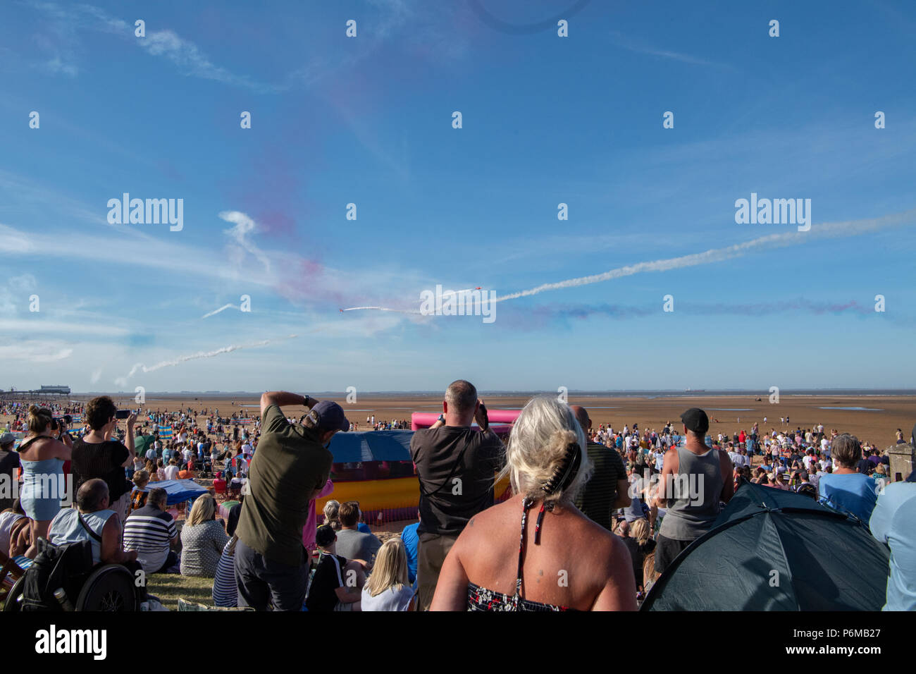Cleethorpes beach, UK. 1st Jul, 2018. Armed response police patrol the crowds with loaded assault rifles at Armed Forces Day on Cleethorpes beach as thirty thousand tourists turn out in 28 degree heat to watch the air displays and military parades. Credit: Steve Thornton/Alamy Live News Stock Photo
