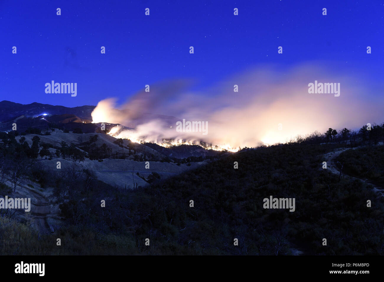 Clearlake Oaks, California, USA. 1st July, 2018. The Pawnee Fire in Lake County showed increased fire activity over the weekend. Red Flag warnings were in effect and strong winds and low humidity contributed to the increased fire behavior. Credit: Neal Waters/ZUMA Wire/Alamy Live News Stock Photo