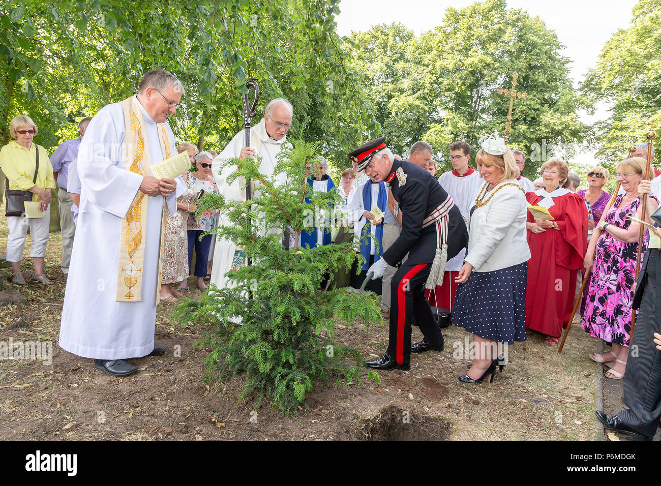 Warrington, UK. 01 July 2018 - The Finale of the Sunday service was taken outside of the church where a yew tree was planted by Cllr Karen Mundry, The Mayor of Warrington, and Thomas David Briggs, MBE, KstJ, Lord Lieutenant of Cheshire whilst the service and prayers were  held by Reverend Michael Ridley, Vicar of St Thomas' and the Rt Reverend Dr Peter Forster, Bishop of Chester Credit: John Hopkins/Alamy Live News Stock Photo