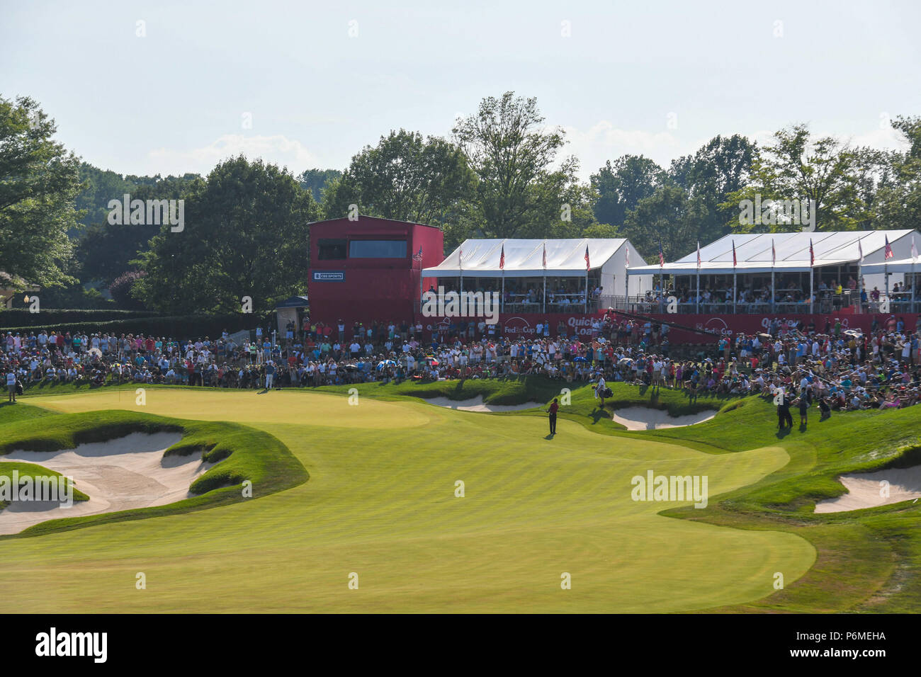 Potomac, MD, USA. 1st July, 2018. Tiger Woods (USA) chips his third shot onto the eighteenth green during the final round at the 2018 Quicken Loans National at the Tournament Players Club in Potomac MD. The largest crowds of the four day tournament stayed at Tiger's side in the near 100 degree heat. Credit: Cal Sport Media/Alamy Live News Stock Photo