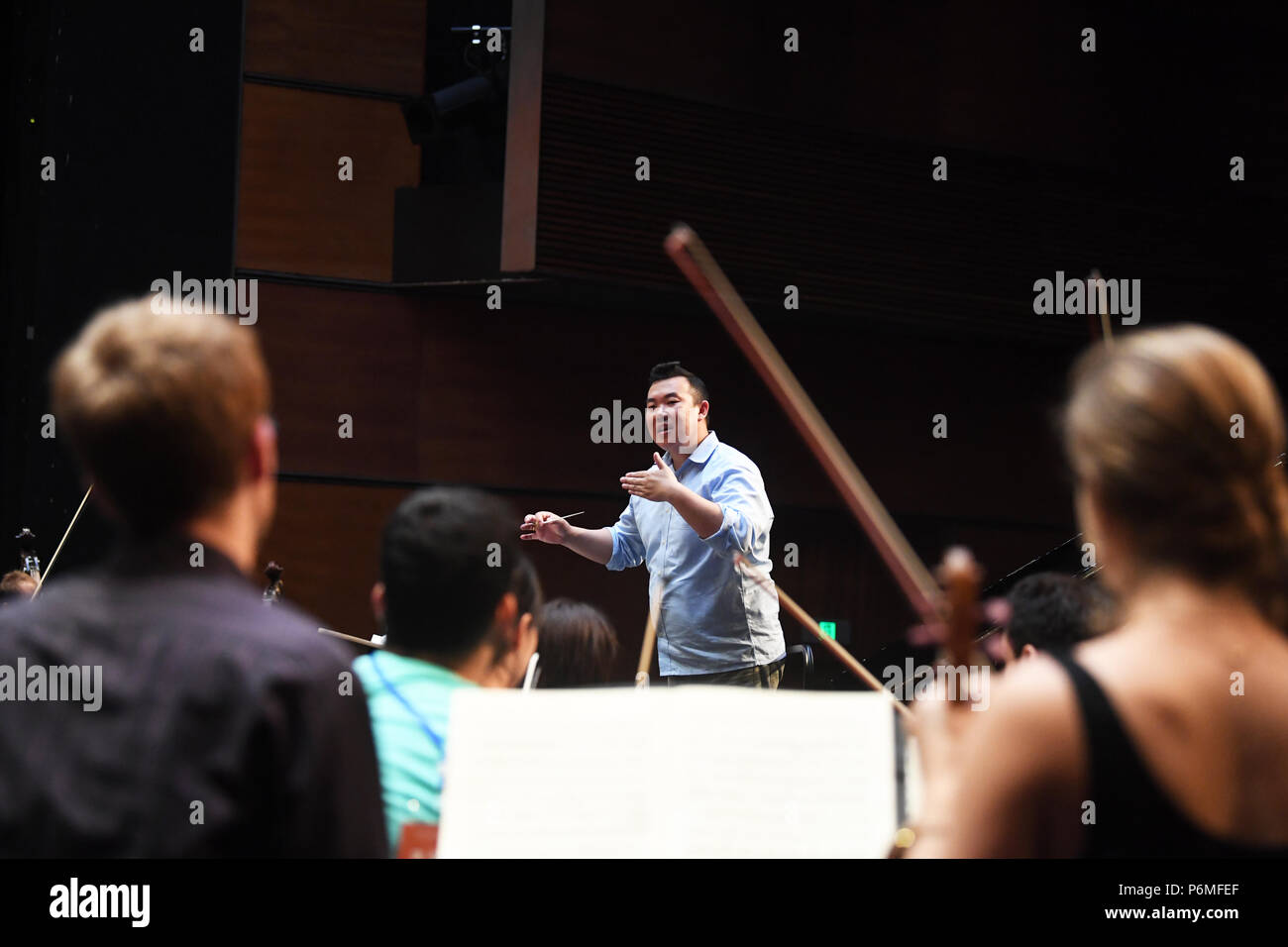 Chongqing, China. 1st July, 2018. Members of the Kammerorchestser Louis Spohr rehearse at the Chongqing Grand Theater in Chongqing, southwest China, July 1, 2018. The concert of the Kammerorchestser Louis Spohr from Germany was staged at the Chongqing Grand Theater on Sunday. Credit: Wang Quanchao/Xinhua/Alamy Live News Stock Photo