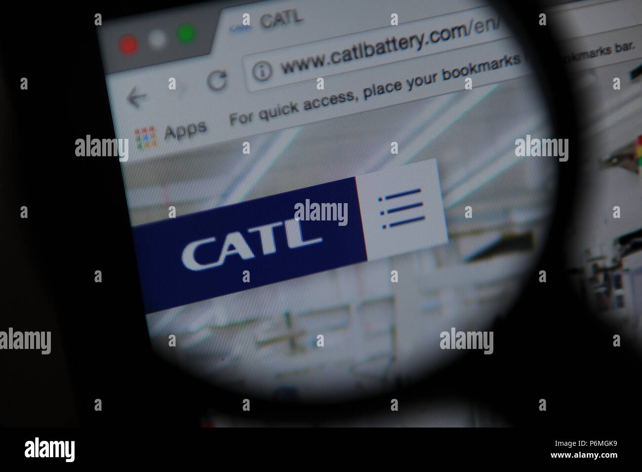 The Contemporary Amperex Technology Co. Limited (CATL) website seen through a magnifying glass Stock Photo