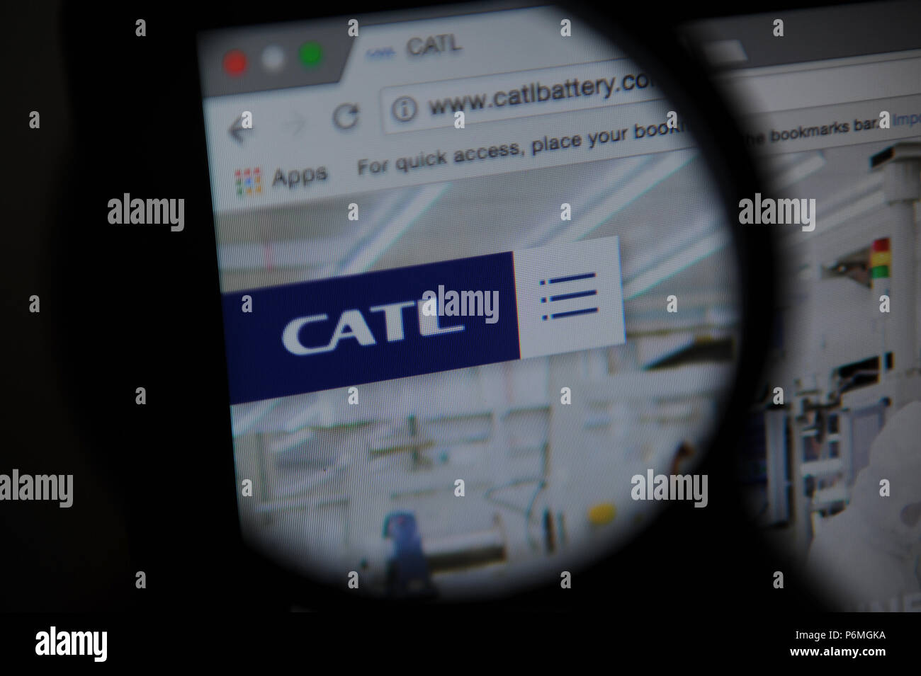 The Contemporary Amperex Technology Co. Limited (CATL) website seen through a magnifying glass Stock Photo