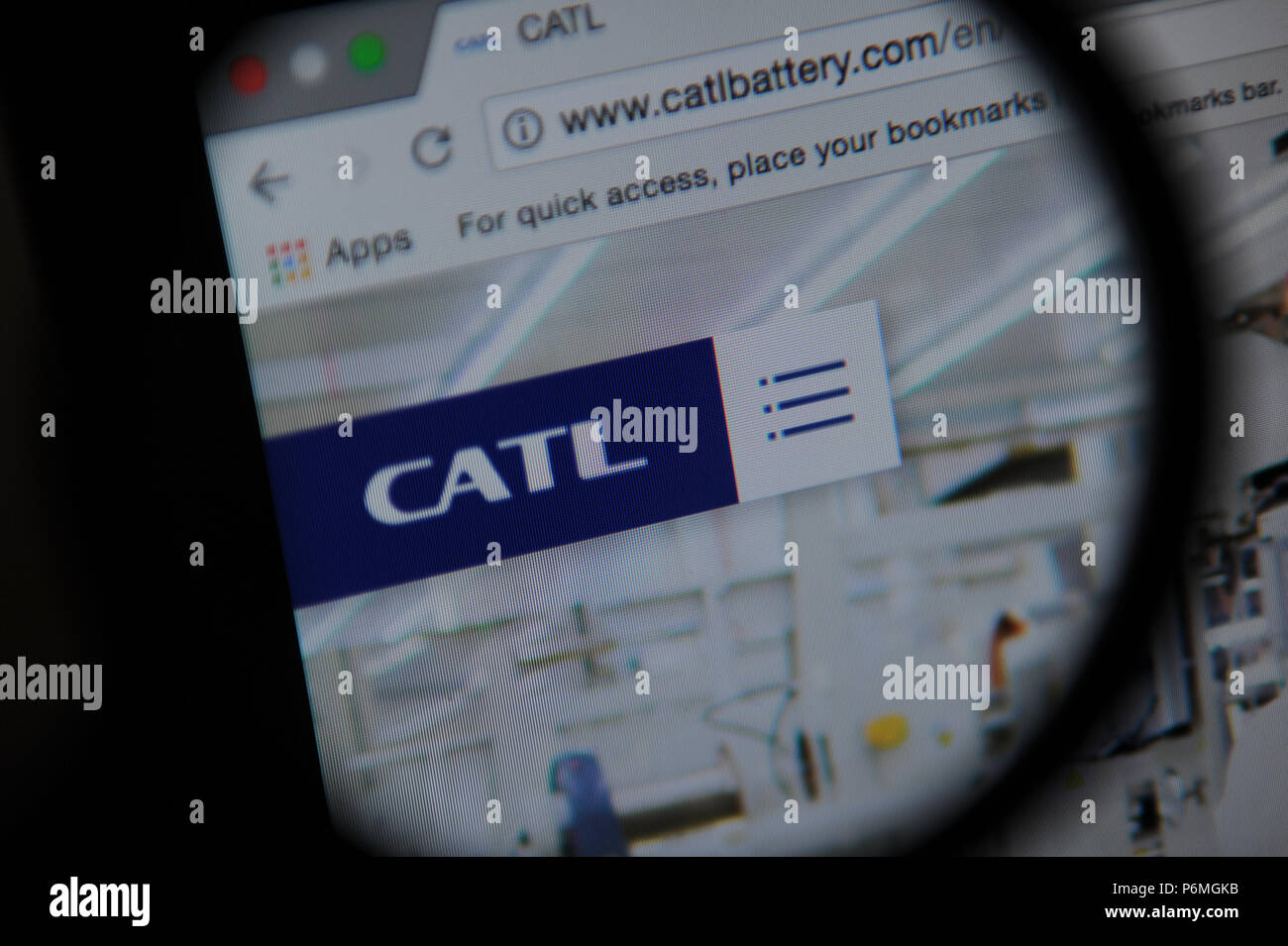 The Contemporary Amperex Technology Co. Limited (CATL) website seen through a magnifying glass Stock Photo