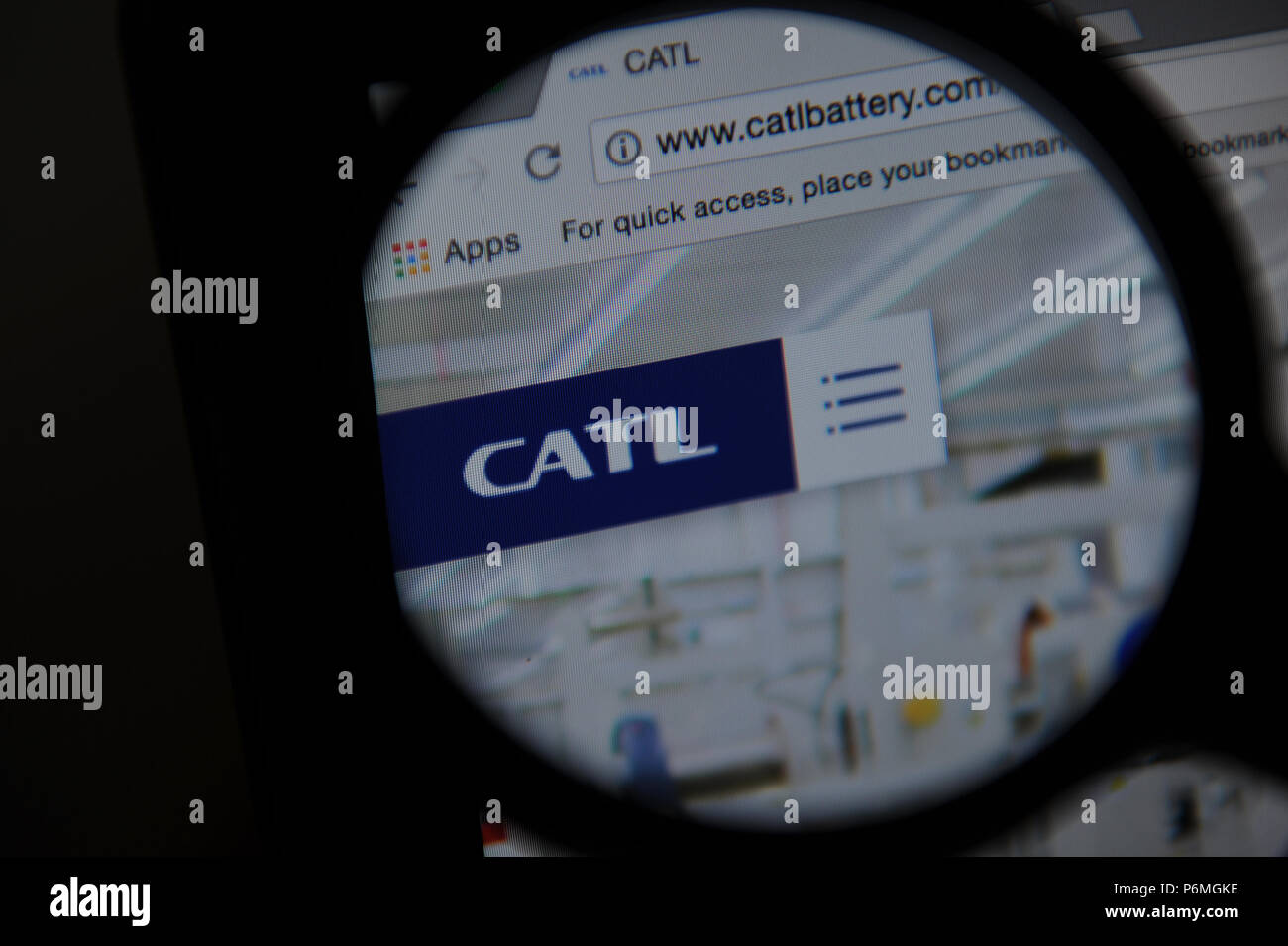 The Contemporary Amperex Technology Co. Limited (CATL) website seen through a magnifying glass Stock Photo