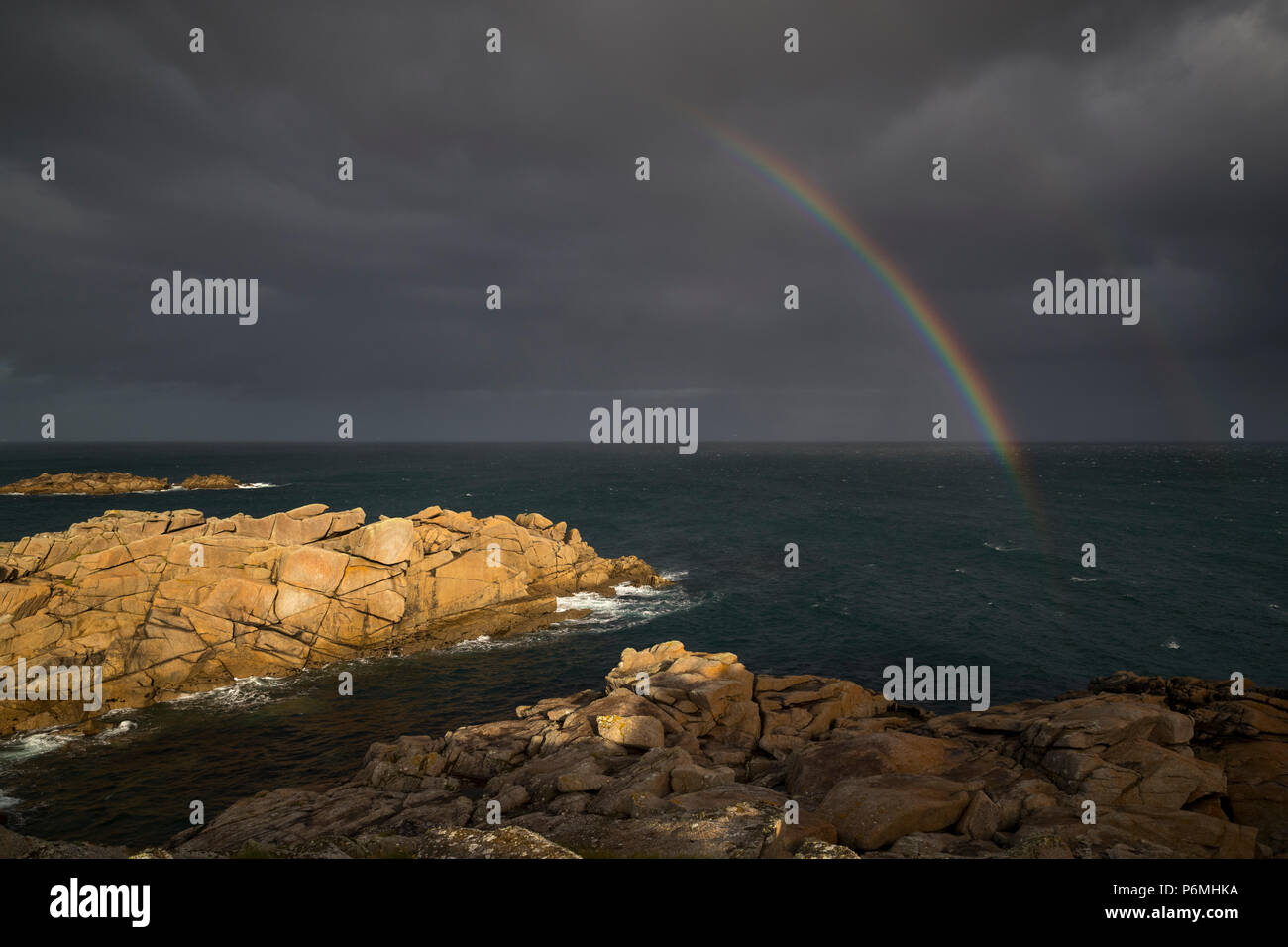Giant's Castle; Rainbow; Porth Hellick; St Mary's; Isles of Scilly; UK Stock Photo