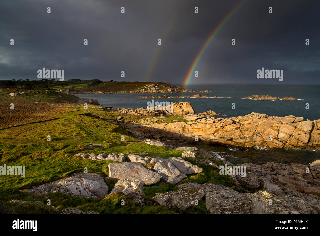 Giant's Castle; Rainbow; Porth Hellick; St Mary's; Isles of Scilly; UK Stock Photo