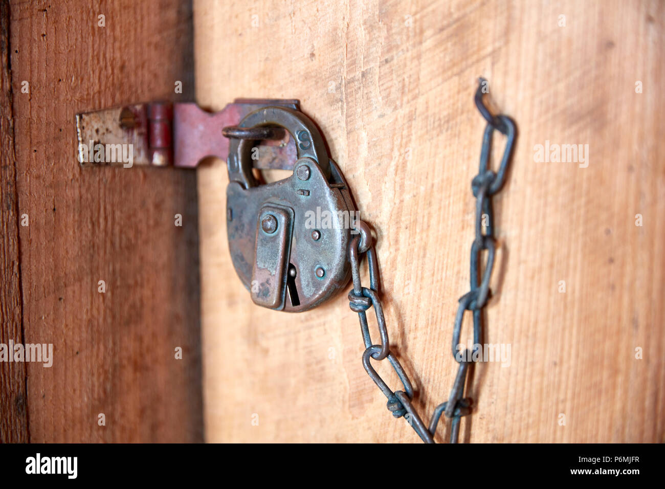 Antique padlock on a door at Fort Clinch State Park, Florida Stock Photo