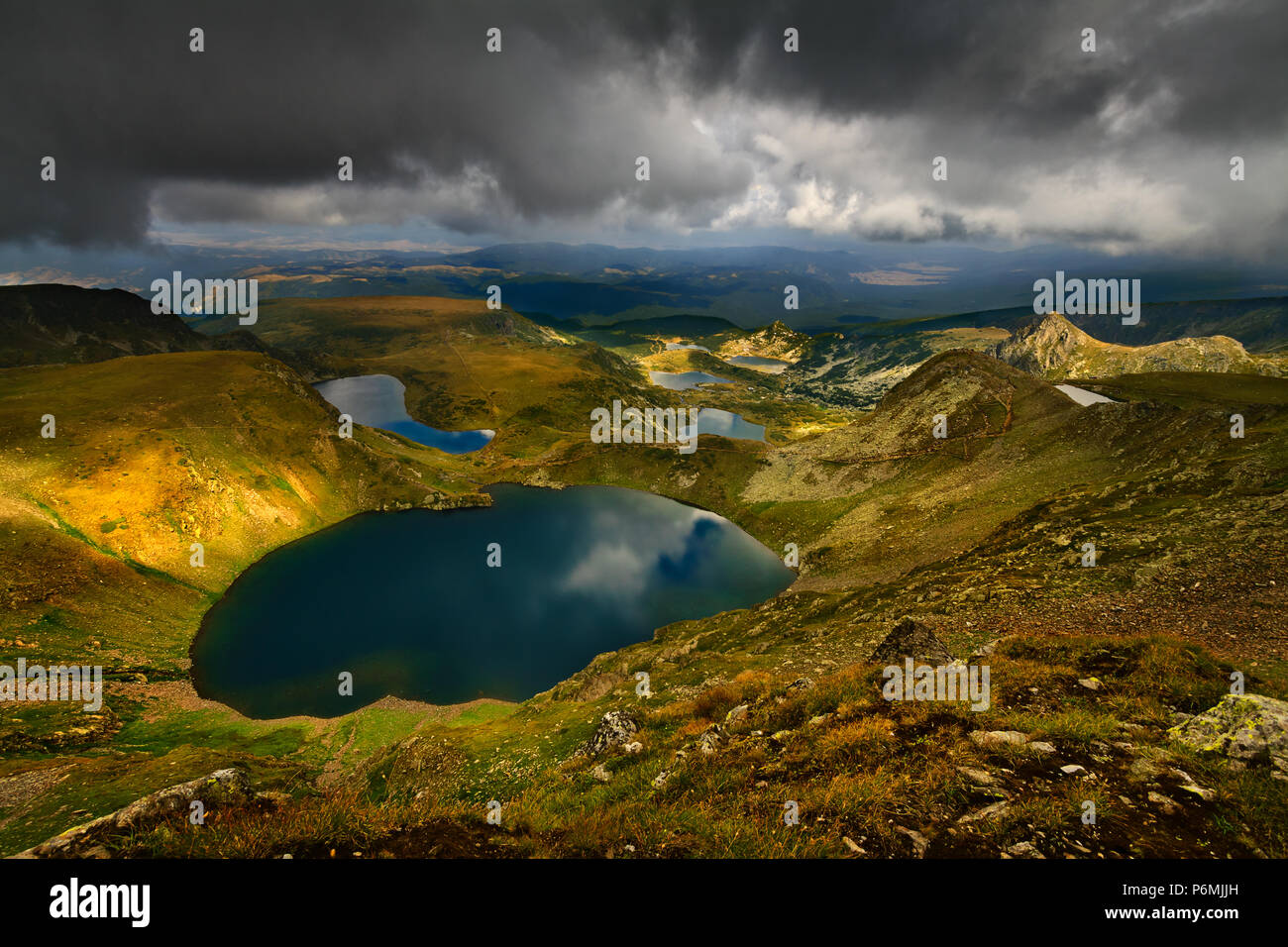 The Seven Rila Lakes are a group of glacial lakes, situated in the northwestern Rila Mountains in Bulgaria. The picturesque landscape in the mountains. Stock Photo