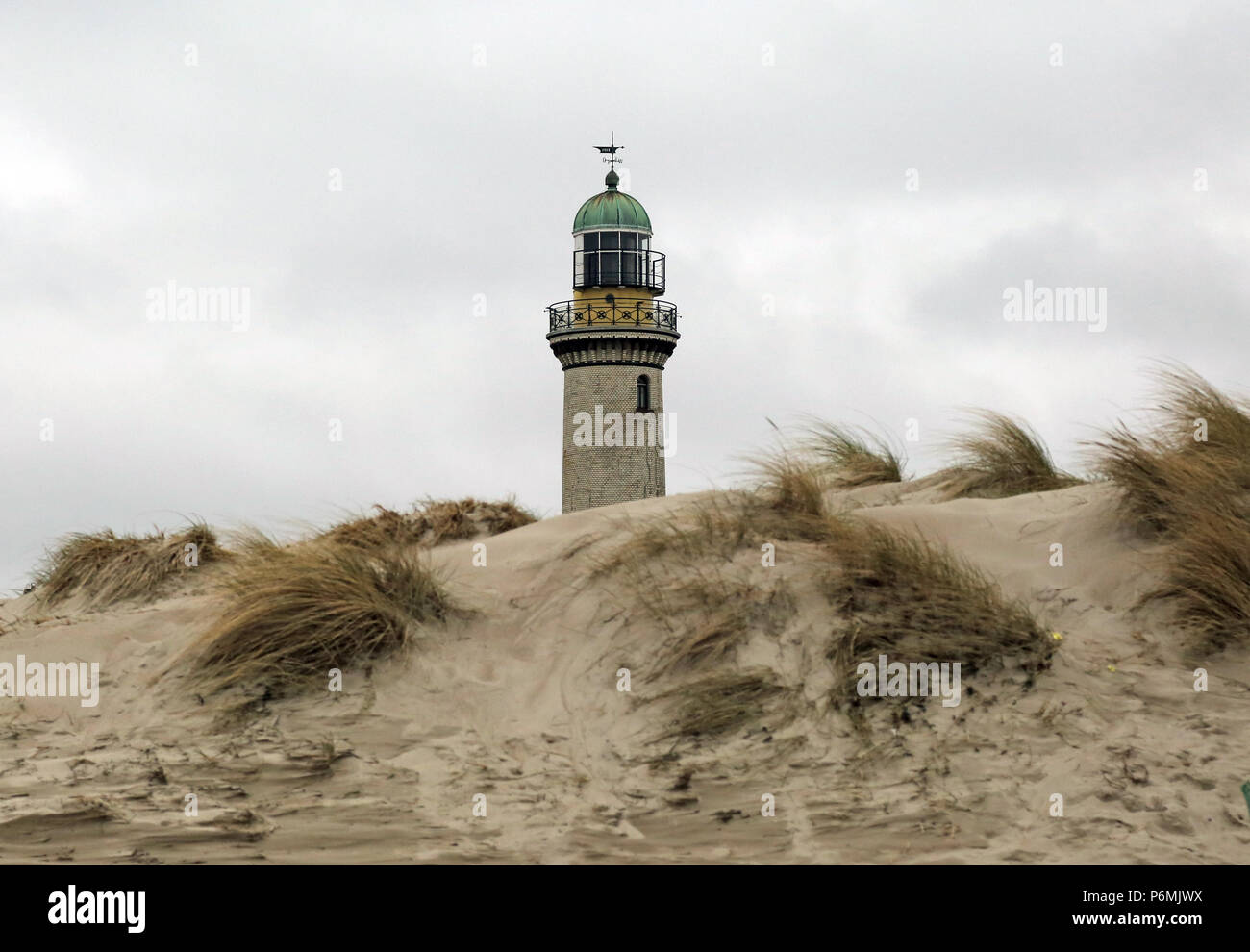 Warnemuende, lighthouse behind a dune Stock Photo