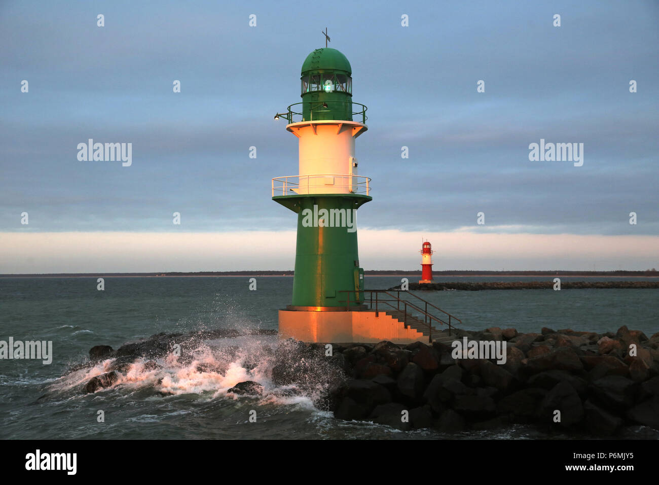 Warnemuende, lighthouses on the West and Ostmole in the evening light Stock Photo