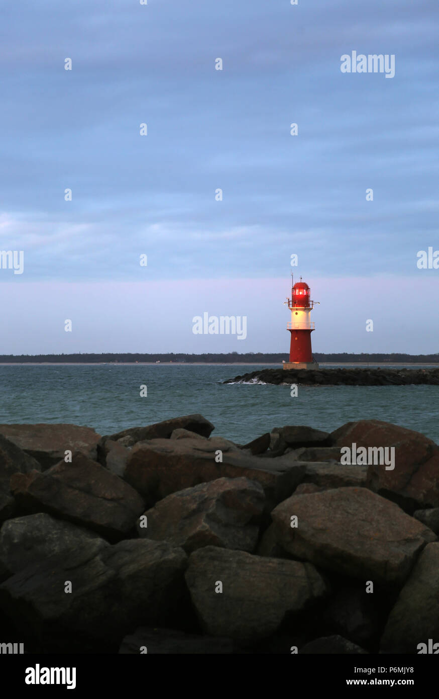 Warnemuende, lighthouse on the east pier in the evening light Stock Photo