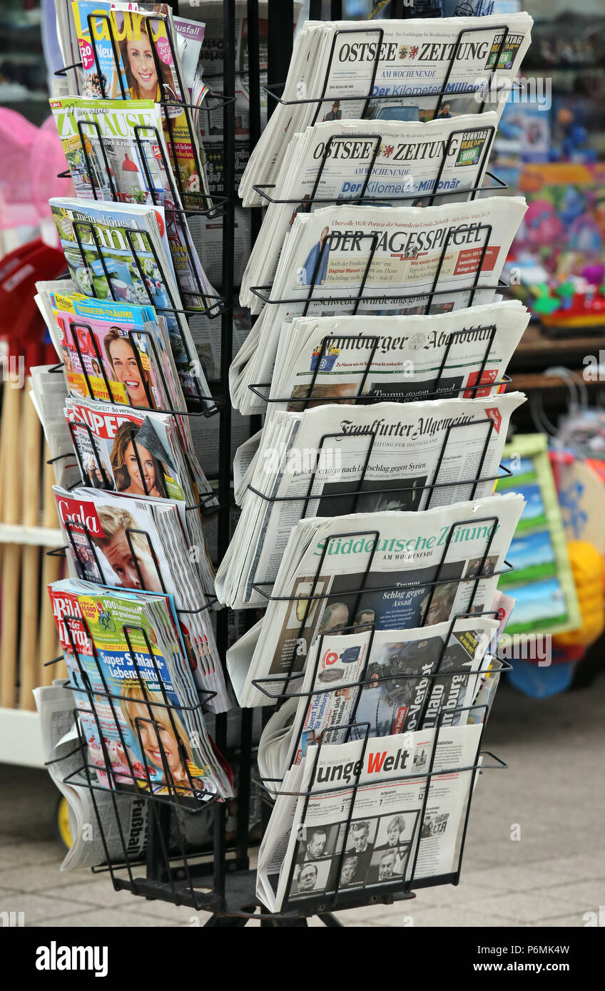 Warnemuende, daily newspapers and magazines in a newspaper stand Stock Photo