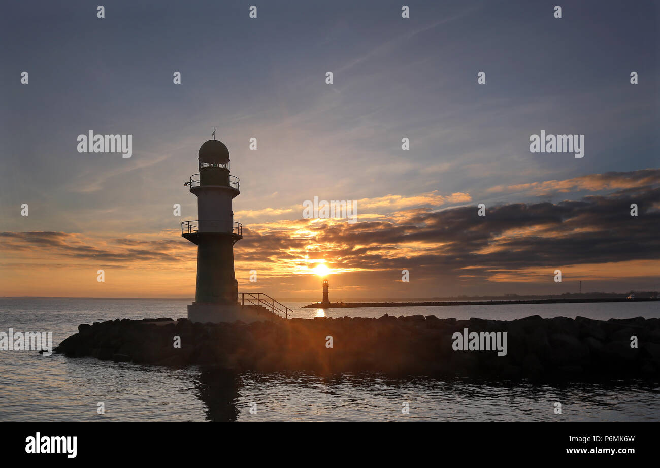 Warnemuende, lighthouses at the pier at sunrise Stock Photo