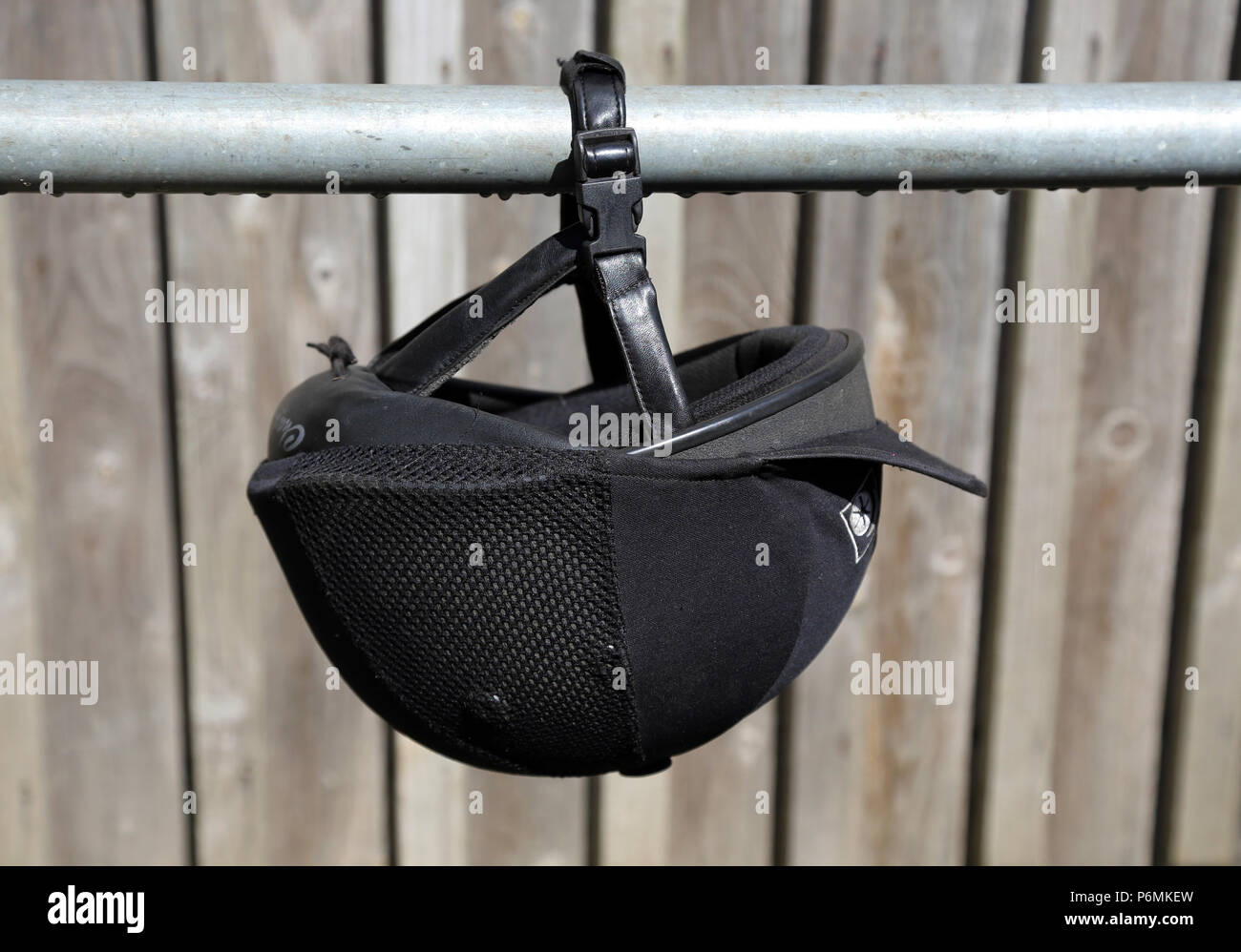 Melbeck, riding cap hangs on a tie rod Stock Photo