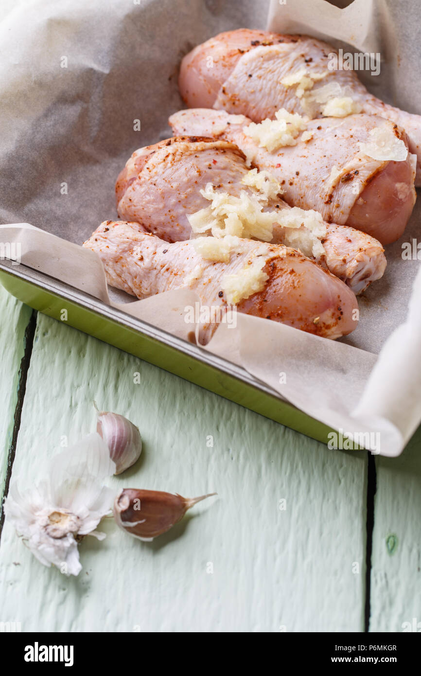 Uncooked poultry thigh on paper Stock Photo Alamy