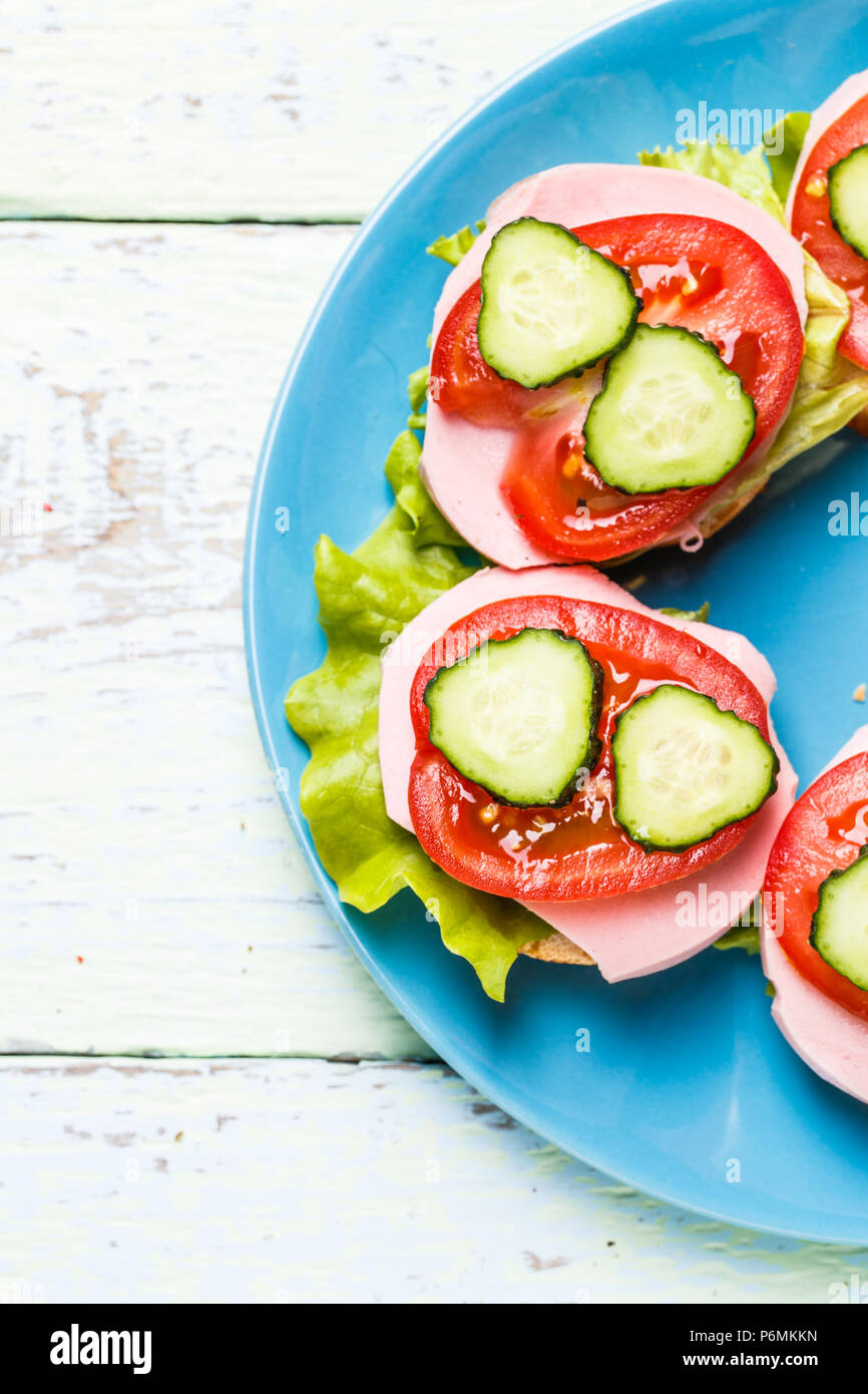 Bruschetta with salad, sausage, tomato and cucumber Stock Photo Alamy