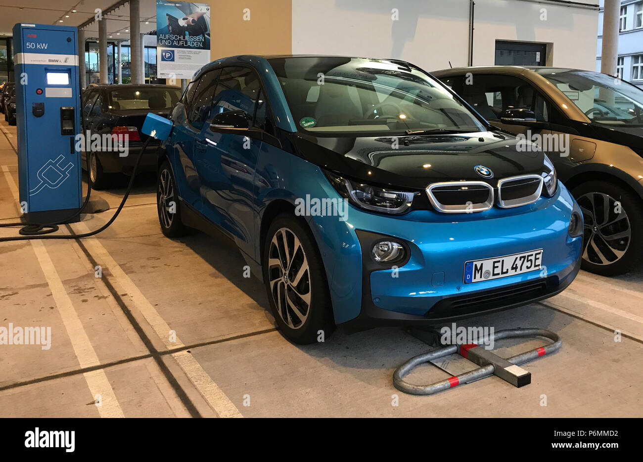 Berlin, electric car is charged Stock Photo Alamy