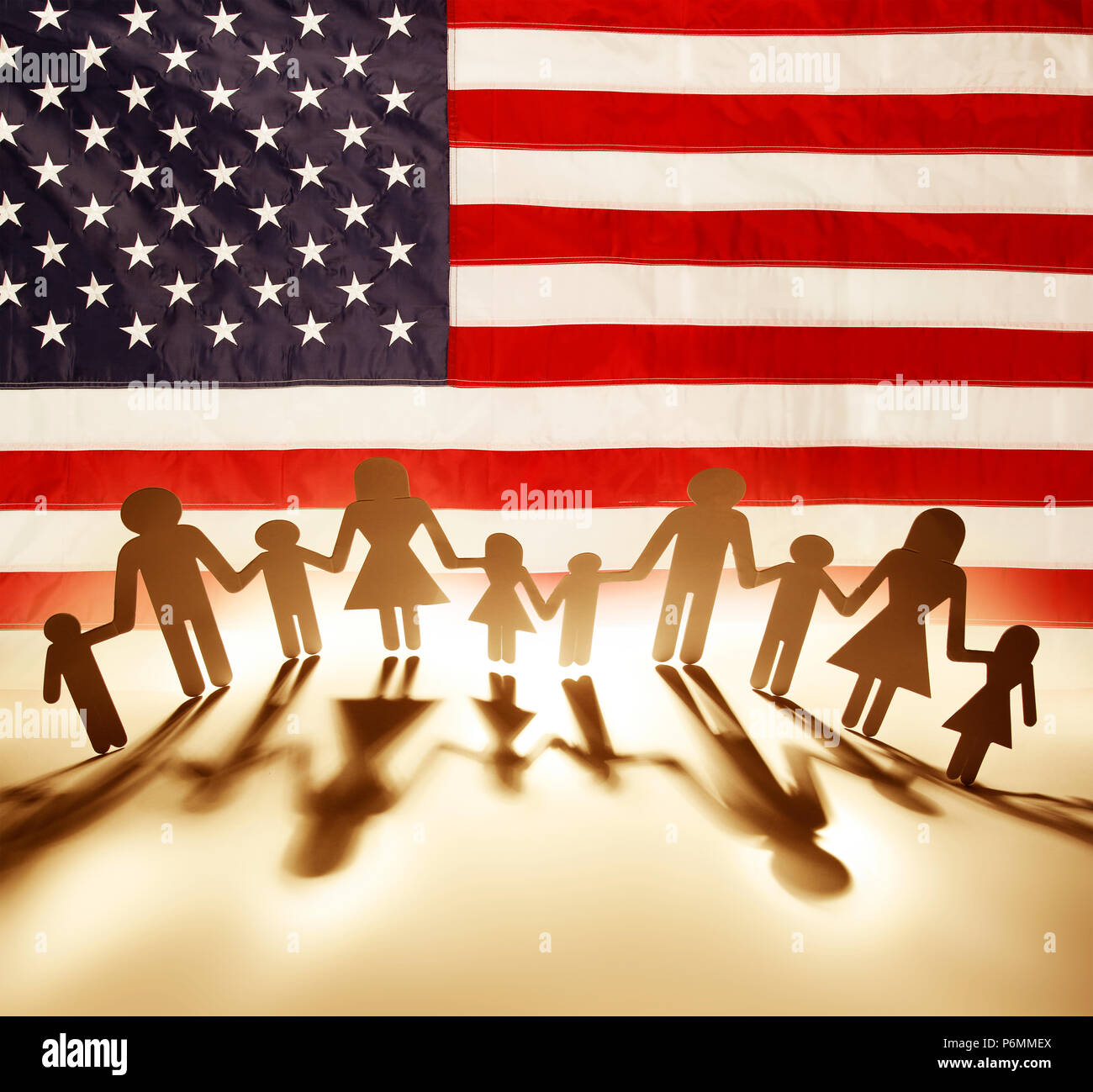 Family paper chain in front of American flag Stock Photo Alamy