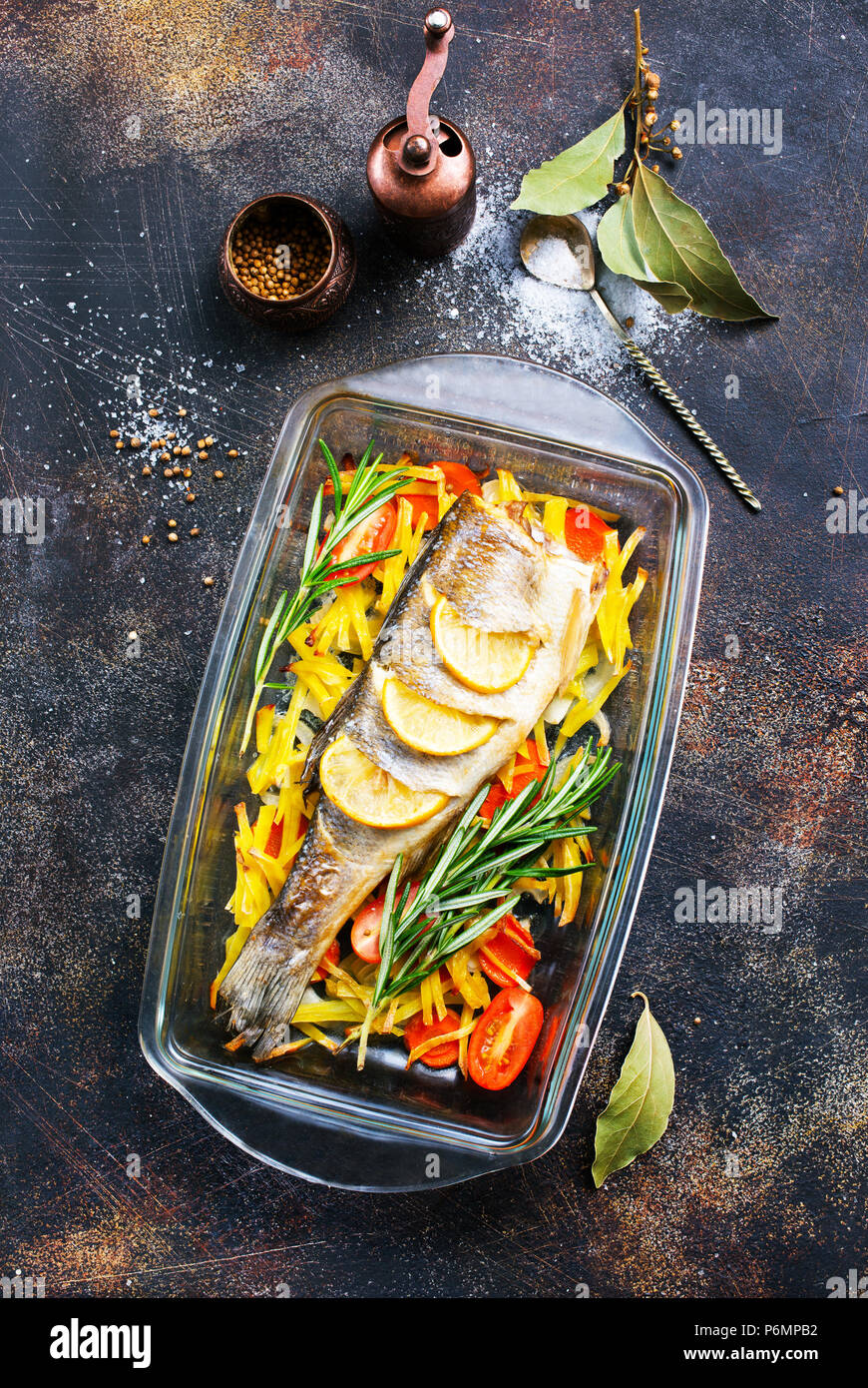 baked fish, baked fish with vegetables on plate Stock Photo - Alamy