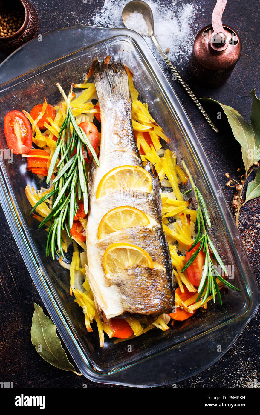 baked fish, baked fish with vegetables on plate Stock Photo - Alamy